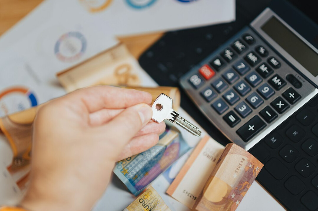 person counting money at home