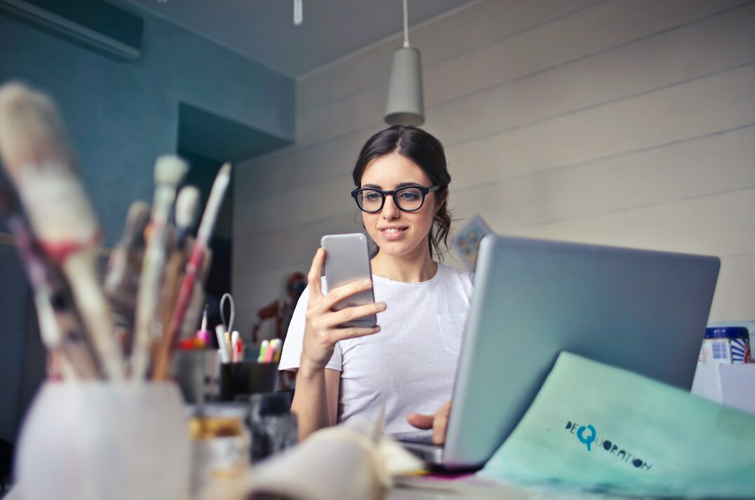 woman reviewing budget on laptop