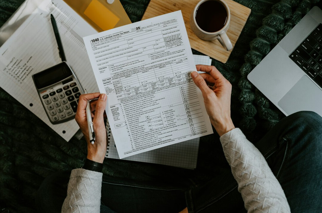 woman calculating expenses at home